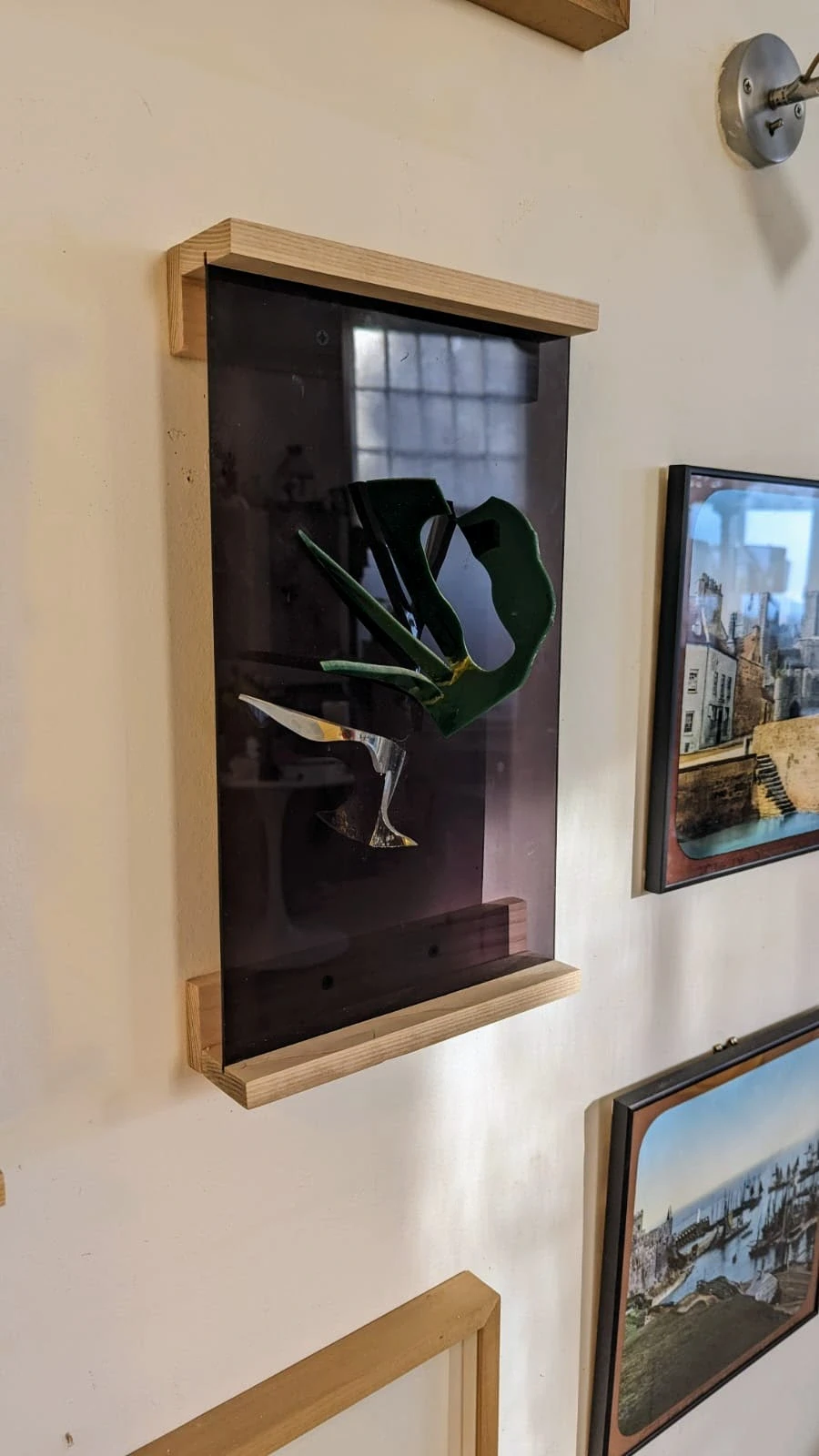 An artwork framed on a wall
