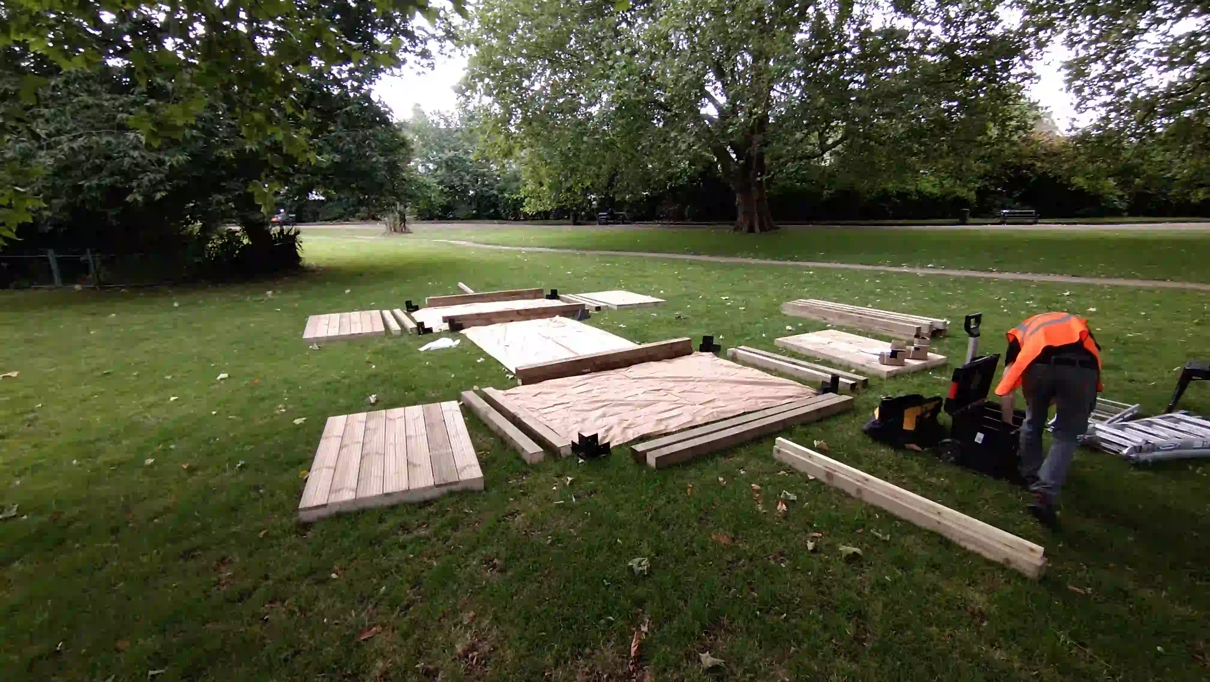 Wood pieces laid out on grass